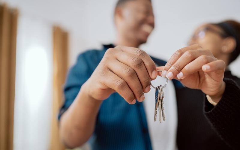 a couple holding a set of keys